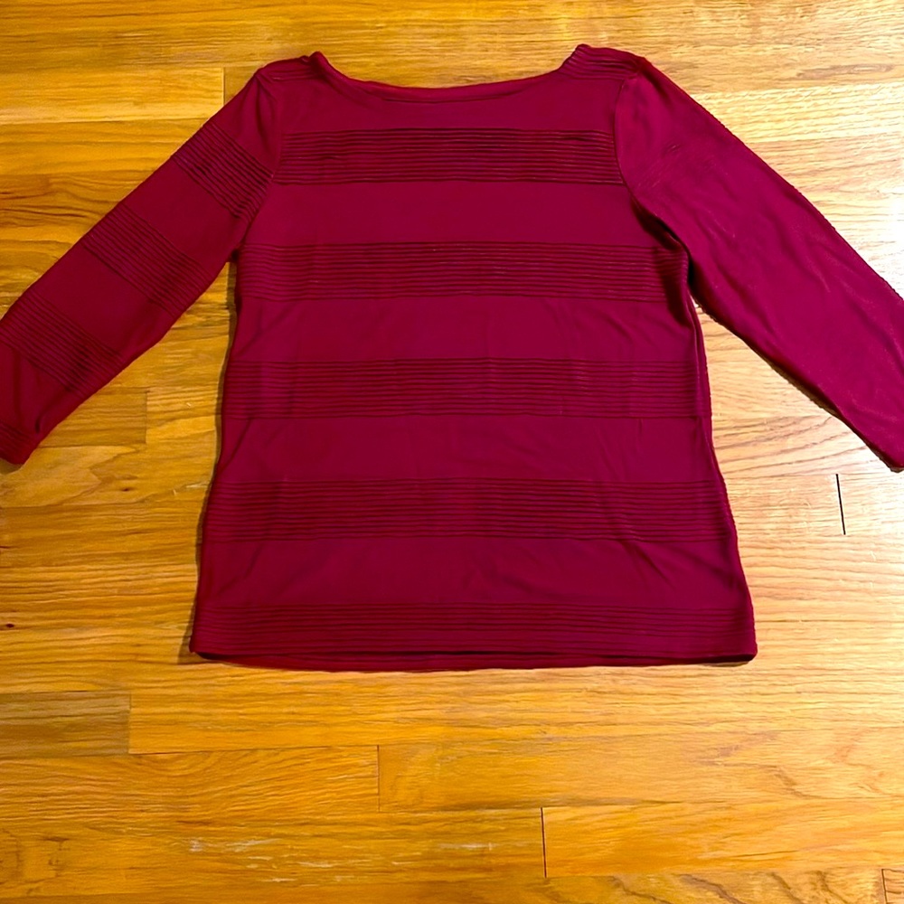 Maroon colored boatneck women’s M top.